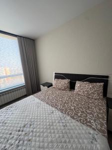 Ένα ή περισσότερα κρεβάτια σε δωμάτιο στο Vacay apartment