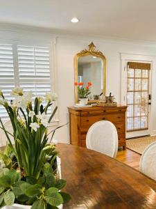 a dining room with a table and a mirror at The Eakes House on South 8th in Oxford