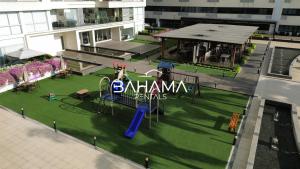 an overhead view of a playground with a fake horse on it at Puerto Santa Ana Luxury Suites Guayaquil in Guayaquil