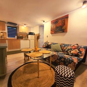 a living room with a couch and a table at Mini CHata in Rydułtowy