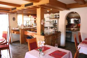 a kitchen with a table and a kitchen with a counter at Cresta Hotel in Klosters