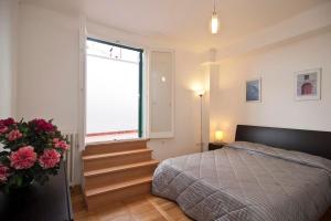 A bed or beds in a room at Romacentrarte