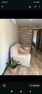 a picture of a bedroom with a bed with pillows at Las andinas in Carmelo