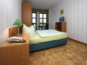 Ένα ή περισσότερα κρεβάτια σε δωμάτιο στο Apartment in fir with a balcony or a terrace +8 φωτογραφίες