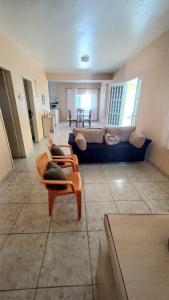 a living room with a couch and a table at Casa temporada, férias e final de semana in Viçosa do Ceará