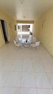 a large room with chairs and a table in it at Casa temporada, férias e final de semana in Viçosa do Ceará