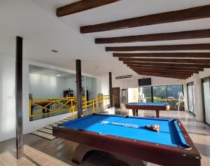 a pool table in the middle of a room at Nacazcol - Playas del Coco in Coco