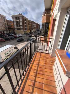 a balcony of a building with a view of a street at Tú casa en Aranda in Aranda de Duero