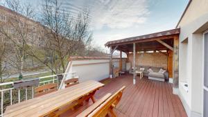 a deck with benches and a pavilion on a building at SAG apartment close to the castle free parking in Bratislava