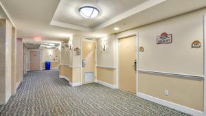 a corridor of a hospital hallway with a hallway at Oceanfront Studio in Daytona Beach Resort in Daytona Beach +14 photos