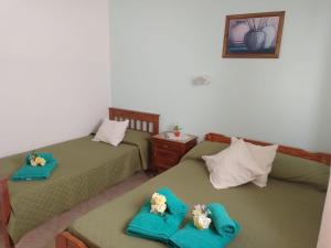 En eller flere senge i et værelse på Hotel El Parque