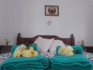 En eller flere senge i et værelse på Hotel El Parque