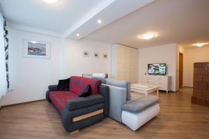Televisyen dan/atau pusat hiburan di Apartments Grom