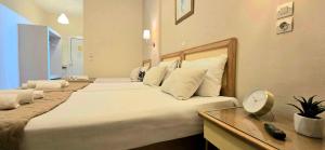 Postel nebo postele na pokoji v ubytování Koulouris Beach Hotel