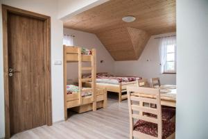 Postel nebo postele na pokoji v ubytování Penzion U Červené podkovy
