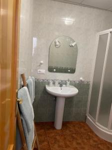 a bathroom with a sink and a mirror at La torrecilla in Zuheros