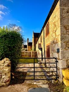 a set of stairs leading up to an old building at Penrhyn Cottage in Penrhyn Bay