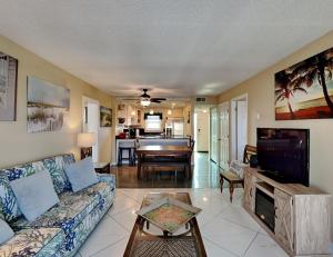 a living room with a couch and a television at Emerald Isle Fort Walton Beach #502 in Fort Walton Beach