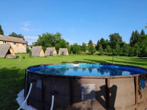 a large trampoline in a yard with at Lika Sunset in Ličko Lešće