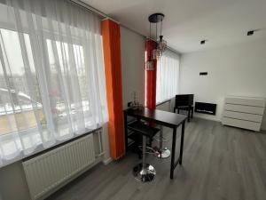 a room with a table and chairs and a window at Cosy Cietoksnis Tūristu mitne in Daugavpils +13 photos