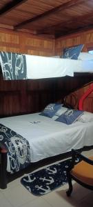 two bunk beds in a wooden room with at Chalet Condominio Campestre Rodadero Santa Marta wifi Piscina Amplia in Santa Marta +24 photos