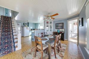 a kitchen and dining room with a table and chairs at Cozy Augusta Home with Porch Walk to Katy Trail! in Augusta
