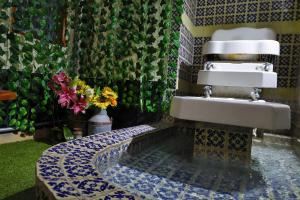 a bathroom with a sink and a blue and white at Azcami Boutique Hotel in Puebla