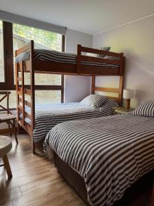 Postel nebo postele na pokoji v ubytování Depto. orilla de lago Villarrica + 27 fotografií