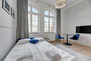 Posteľ alebo postele v izbe v ubytovaní Apartments Waterlane Vintage & by Noclegi Renters
