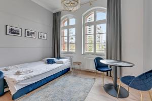 Posteľ alebo postele v izbe v ubytovaní Apartments Waterlane Vintage & by Noclegi Renters