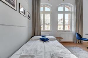 Posteľ alebo postele v izbe v ubytovaní Apartments Waterlane Vintage & by Noclegi Renters