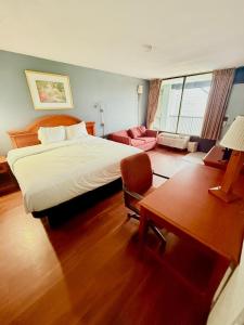 Postel nebo postele na pokoji v ubytování Vip inn and suites