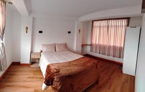 Postel nebo postele na pokoji v ubytování Panoramic Cusco