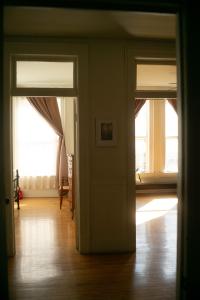 an empty room with two doors and a hard wood floor at Object Hotel 2BR Room 2B in Bisbee