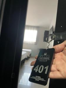 Postel nebo postele na pokoji v ubytování Hotel Escorial Ibagué