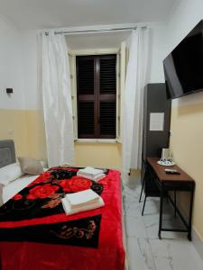 Postel nebo postele na pokoji v ubytování RATTAZZI ROMA CENTRo