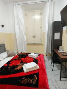 Postel nebo postele na pokoji v ubytování RATTAZZI ROMA CENTRo