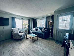 a living room with a couch and a table at Playa Esmeralda INN Suite 2 in Bradenton Beach