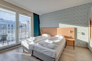Posteľ alebo postele v izbe v ubytovaní Apartments Old Town Angielska Grobla & by Noclegi Renters