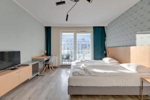 Posteľ alebo postele v izbe v ubytovaní Apartments Old Town Angielska Grobla & by Noclegi Renters