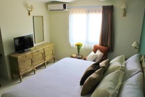 Телевизор и/или развлекательный центр в Entre Patios Hotel Boutique +63 фотографии