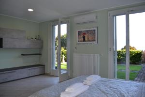 Postel nebo postele na pokoji v ubytování Menaggio Lake View - Villetta con vista!