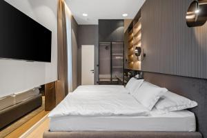 Postel nebo postele na pokoji v ubytování Monamel Luxury Suites