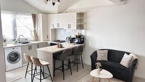 a kitchen with a couch and a table in a room at DURU luxury property in Rădăuţi