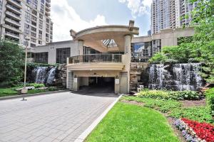 a building with a fountain in front of a building at Amazing 2BR & 2BTH - Near Square One Mall in Mississauga