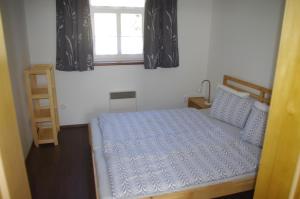 Posteľ alebo postele v izbe v ubytovaní Apartment Baťův Domek