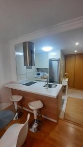 Kuchyň nebo kuchyňský kout v ubytování Apartamento auditorio centro + 2 fotografie