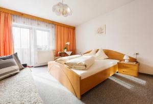 Cama o camas de una habitación en Ferienwohnung Anna Falkner