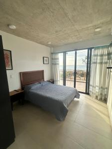 Katil atau katil-katil dalam bilik di Punta Conejo Casa Cielo frente a la playa