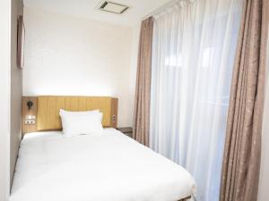 Postel nebo postele na pokoji v ubytování Tokyu Stay Nihonbashi
